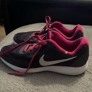 Pink and purple Nike shoes